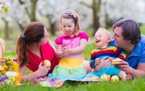 Image of a family playing in a garden