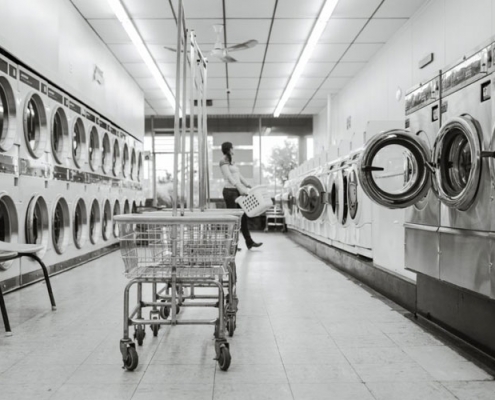 Black and white image of a laundromat