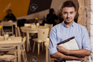 Image of elegant small restaurant manager at work