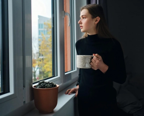 Image of a woman by the window